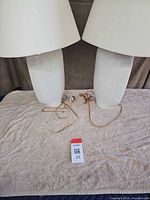 Front view of both lamps showing bases, shades, cords
