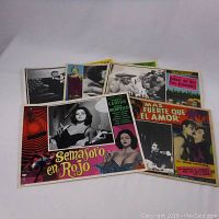 View of all 5 vintage Mexican movie lobby card posters arranged side by side, showing colorful titles and black and white images.
