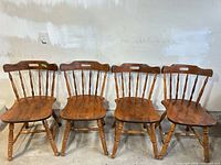 Front view of four Rosaire Bédard solid wood chairs