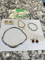 All five jewellery items laid out together