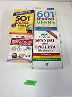Front covers of four Spanish reference books