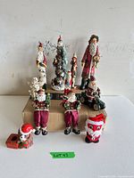 Group shot of all nine Christmas figurines on table