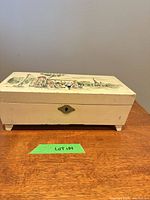 Closed jewelry box front view showing escutcheon