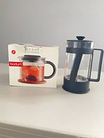 Boxed Le Pot teapot beside assembled French press