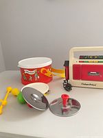 Group shot showing drum, cymbals, tambourine, maraca and cassette recorder