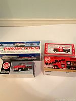 Group shot of all four boxed die-cast vehicles