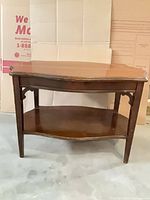 front view of solid wood side table showing top and lower shelf