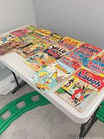 Overall view of comics laid out on table