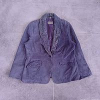 Full front view of the jacket laid flat showing overall design and color