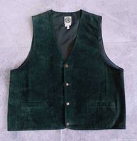 Front view of green suede vest showing buttons and pockets