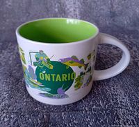 Mug side view showing Ontario graphics and green interior