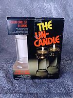 front of boxed Corning The Un-Candle set