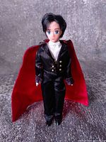 Full-length front view of Tuxedo Mask doll showing outfit and cape
