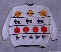 Front view of sweater showing complete Halloween design