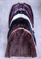 Stacked view of 15 jackets showing front brown suede piece and assorted colors behind