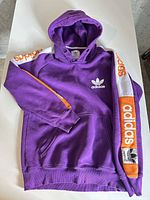 Full view of purple Adidas hoodie front