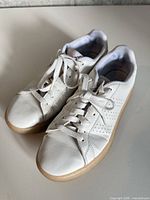 Oblique view of both sneakers showing uppers, laces, and toe boxes