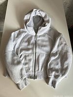 Front view of grey Lululemon full-zip hoodie