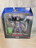 Front of sealed Skelegod figure box showing figure and accessories