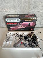 Overall view of box, tray, Zapper and controller