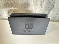 Front view of black Nintendo Switch dock standing upright