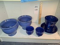 Group shot of all blue pottery items
