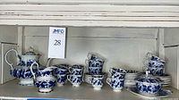 Full view of tea set on shelf showing quantity and pattern