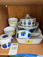 Group view of all ceramic pieces on shelf showing patterns and quantity