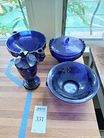 Overview of all four cobalt blue glass pieces