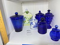 Full group of canisters and jars on shelf