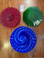 Top view of all three art glass bowls showing colors and shapes