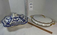 Both tureens side by side with ruler for scale