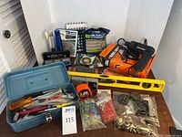Overview of lot with drill, toolbox, level, lantern, hardware, tools
