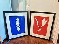 Both framed Matisse prints standing side by side