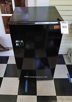 Full front view of black Frigidaire mini fridge