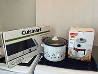All three boxed appliances with slow cooker displayed