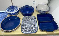 Top-down view of all six ceramic pieces arranged together