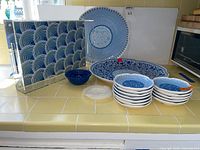 Full lot showing tray, platters, plates, bowls