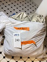 Deflated Serta twin air mattress in plastic bag labeled air bed and twin