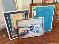 All three framed artworks standing together
