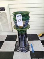 jardiniere pot seated on pedestal column