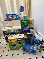 Group shot showing paper goods, Waterpik, Ziploc bags, Kleenex, step stool