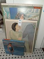 Front view of three stacked artworks showing subjects and relative sizes