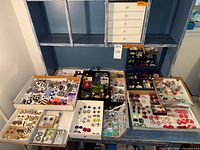 overview of jewelry trays with earrings and boxes