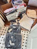 Overview of boxed and packaged apparel on floor