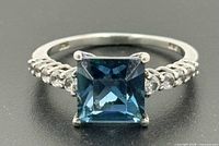 Top view showing square blue topaz and accent stones