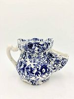 Front view of blue and white floral ceramic shaving scuttle mug