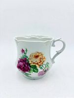 Front view showing rose decoration and handle