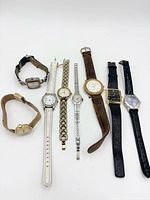 All nine watches laid out side by side