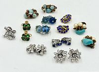 Full array of twelve pairs of vintage costume earrings displaying colours and styles